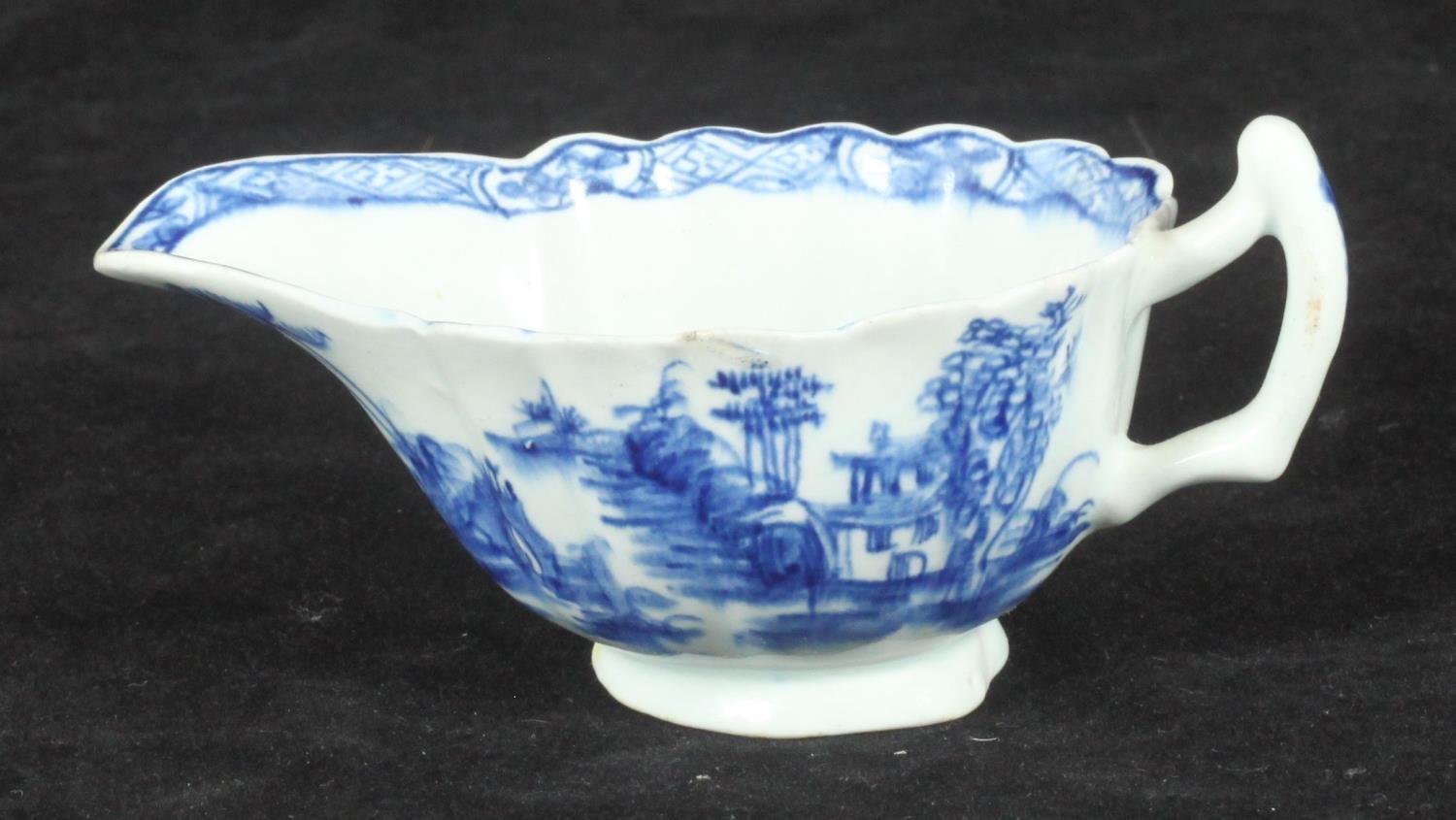 A Bow porcelain cream boat painted in underglaze blue in the 'Desirable Residence' pattern, No. '56'