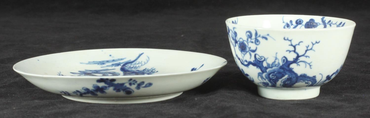 A Worcester Porcelain tea bowl and saucer, c1760, decorated in underglaze cobalt blue with the '