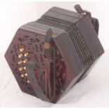 A Lachenal & Co concertina, with fretwork pierced rosewood sound frets, bone buttons and makers