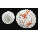 A Chelsea 'Raised Anchor' period fluted teabowl and saucer in the Kakiemon style, painted with