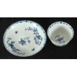 A Worcester porcelain tea bowl and saucer, 'feather mould and floral painted,' in cobalt blue,