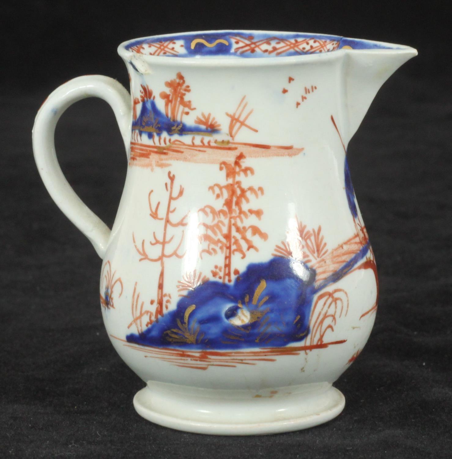 A William Ball Liverpool Porcelain 'sparrow beak' cream jug decorated with a 'man on a bridge' in