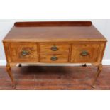 A 19th century mahogany side table with two central drawers flanked by pair cupboard doors on