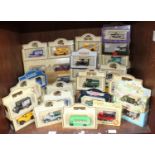 SECTION 39. A collection of approximately 40 assorted boxed die-cast model vehicles, comprising some