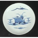 A Longton Hall porcelain saucer decorated in underglaze blue with a chinoiserie landscape, chip to