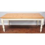 A rectangular pine topped and white painted dining table, 197cm long, together with six dining