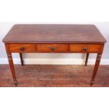 A stained walnut hall table with frieze drawers and faux frieze drawers to either side, all with