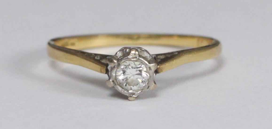 An 18ct gold solitaire diamond ring, estimate 0.15 carats, weighing 1.6 grams. Ring size M