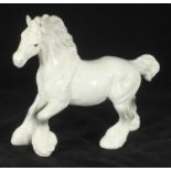 A Beswick pottery model of a cantering Shire horse, in white gloss with grey dapples, model no. 975,