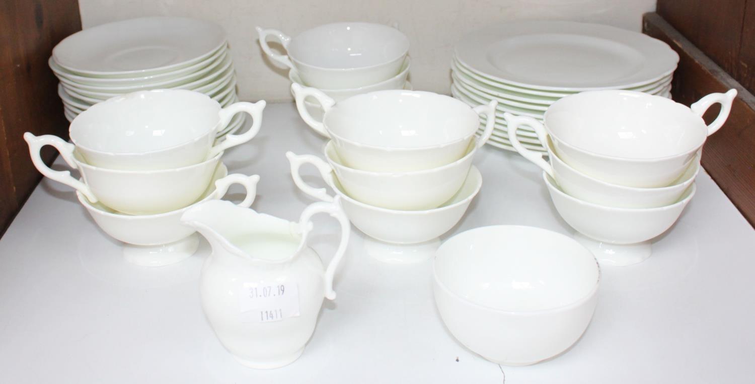 SECTION 17. A 37-piece part tea set, largely by Coalport, all decorated in plain white, comprising