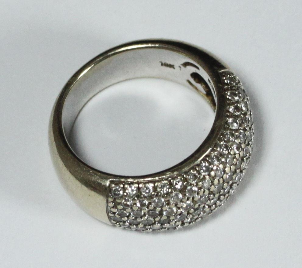 An 18ct white gold wide band pave-set with 1.00 carat of RBC diamonds. Total weight of ring 11.