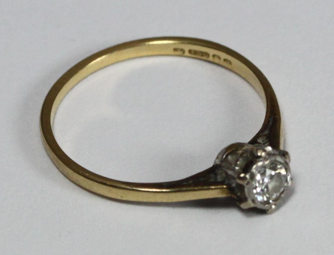 An 18ct gold solitaire diamond ring, estimate 0.15 carats, weighing 1.6 grams. Ring size M - Image 2 of 2