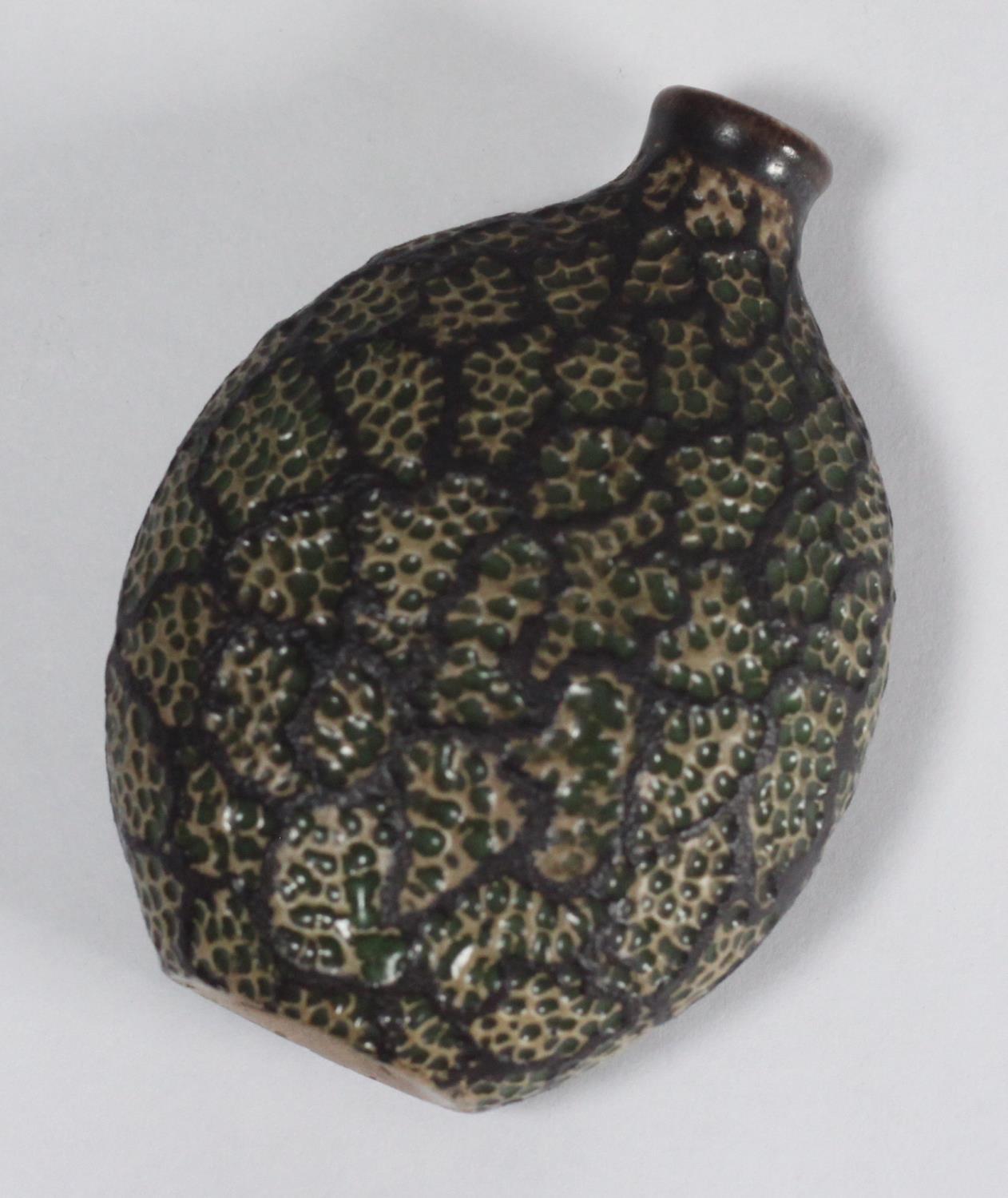 A small Martin Brothers vase of ovoid snuff bottle form with cylindrical neck, the body decorated in