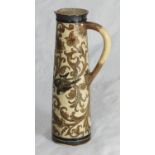 A 19th century Martin Brothers ewer of tapering cylindrical form, the body decorated with birds
