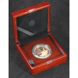 A Royal Mint 'The Sapphire of Her Majesty The Queen,' £5 gold coin, proof struck, 916.7 Au, 39.