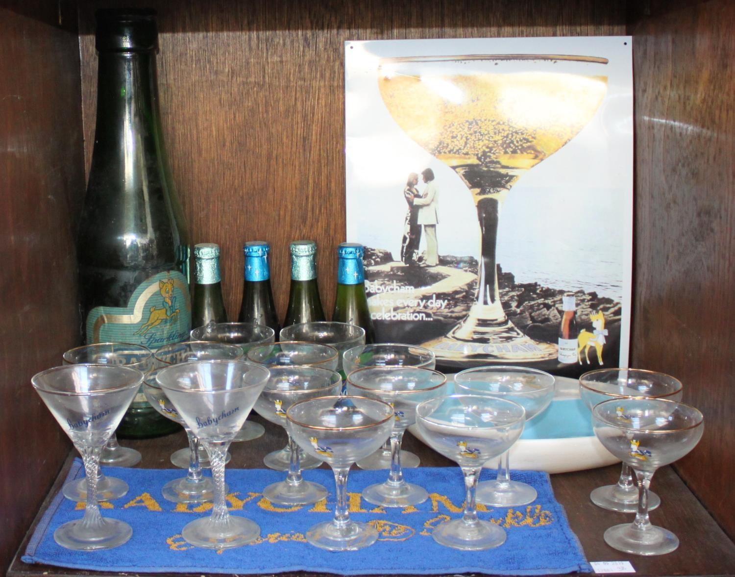 SECTION 38. A quantity of Babycham memorabilia including an over-sized glass bottle, four small