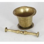 A 17th/18th Century polished bronze pestle and mortar.