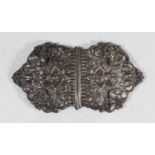 A Victorian two-piece silver nurses buckle by Charles Stuart Harris, decorated with birds amidst