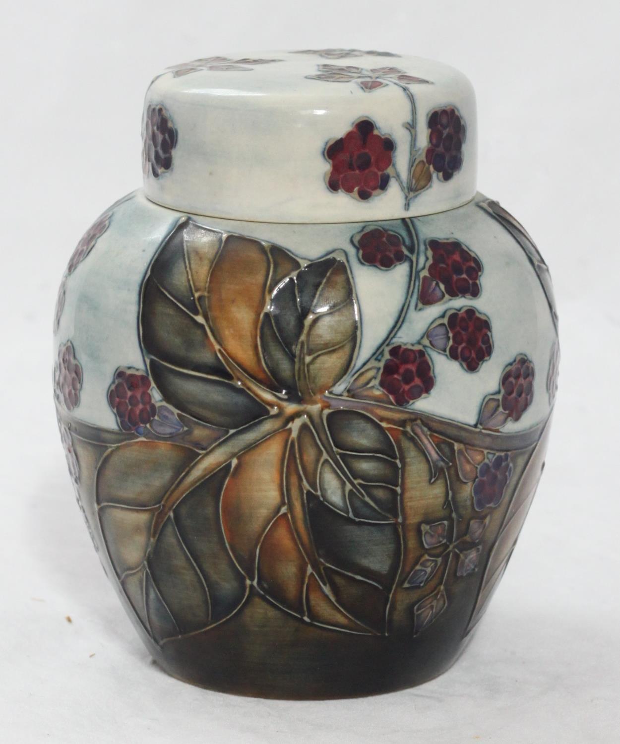 A Moorcroft pottery ginger jar and cover in the 'Bramble' pattern designed by Sally Tuffin, the base