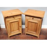 A pair of stripped and waxed pine bedside pot cupboards