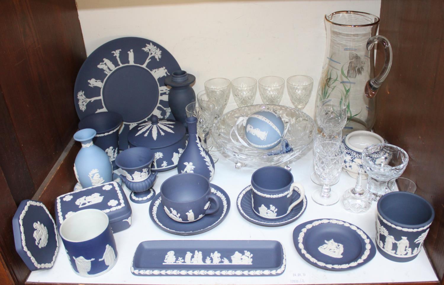 SECTION 3. A large quantity of Wedgwood dark blue Jasperware including cups and saucers, trinket