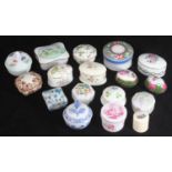A collection of 17 assorted ceramic pill boxes, one boxed, the rest loose, predominantly with floral