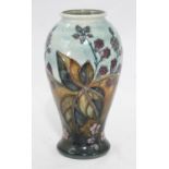 A Moorcroft pottery vase in the 'Bramble' pattern designed by Sally Tuffin, of inverted baluster
