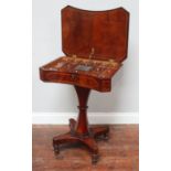 A regency mahogany ladies work table, with concave bow front, the rise and fall top with fitted