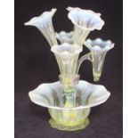 A Victorian yellow glass epergne with three large and three small trumpet shaped vases with wavy