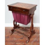 A 19th century mahogany combined games and sewing table, the rectangular top with an alternating