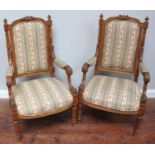 A pair of 19th century French walnut open armchairs, with finely craved walnut frames, upholstered
