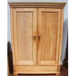 A 19th century stripped and waxed pine double wardrobe, 144cm wide