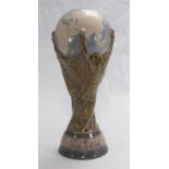 A rare Lladro porcelain copy of the FIFA World Cup, together with a photograph of England?s most