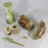 A small collection of assorted onyx items comprising a vase, a pair of candlesticks, a pair of