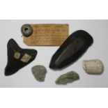 A a fossilised shark's tooth, Stone Age flint adze together with a carved sandstone head and Irish