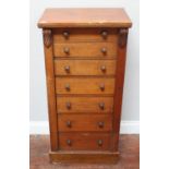 A Victorian oak Wellington chest of seven drawers, 51cm wide (some fading and water stain to top)