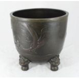 A 19th century Chinese bronze jardiniere of cylindrical form, the sides cast in relief with dragons,