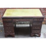 A reproduction mahogany twin pedestal desk with inset gilt-tooled green leather scribe, 120cm wide.