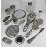 A four-piece silver-backed brush and mirror and a circular picture frame, together with six silver-
