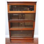 A Globe-Wernicke four-section stained walnut glazed bookcase, 87cm wide