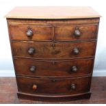 A 19th century flame mahogany bow-front chest of two short and three long graduate drawers wit