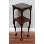 A stained wood Oriental two-tier square occasional table / jardiniere stand with shaped and carved