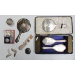 A six piece silver backed brush & mirror set together with silver topped glass jar, silver hand