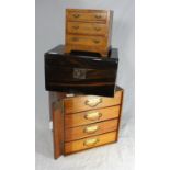 An Edwardian stained walnut table-top collectors cabinet with four drawers and vertical hinged