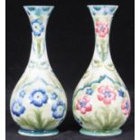 A pair of Moorcroft & Macintyre Pottery vases, shaped 80, typically decorated with Persian style