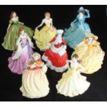 Four Royal Doulton porcelain ladies and four Coalport porcelain ladies