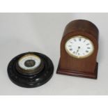 An Edwardian mahogany mantel clock, with white enamel dial, Roman numerals, arched case, 20cm