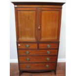 A 19th century mahogany linen press, with plain cupboard doors enclosing shelves, above two short