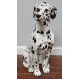 A life size ceramic model of a seated Dalmatian dog, 78cm tall