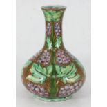 A Della Robbia pottery vase of onion form, incised and painted decoration of stylised fruiting grape